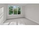 Sun-filled bedroom featuring neutral walls, carpet and a large window at 810 Maple Berry Ln # 105, Raleigh, NC 27607