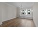 Inviting dining room with natural light and hardwood floors, ideal for Gathering gatherings and entertaining at 810 Maple Berry Ln # 105, Raleigh, NC 27607