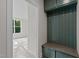 Mud room with built-in bench, storage, and a view to the adjacent living space at 810 Maple Berry Ln # 105, Raleigh, NC 27607