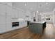 Stylish kitchen with white cabinets, stainless steel appliances, and a gray island perfect for entertaining at 810 Maple Berry Ln # 105, Raleigh, NC 27607