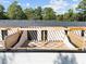 Private rooftop patio features a designer pergola and a stylish tile surface at 810 Maple Berry Ln # 105, Raleigh, NC 27607