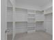 Spacious walk-in closet featuring built-in shelving and ample storage at 810 Maple Berry Ln # 105, Raleigh, NC 27607