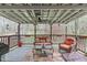 Inviting back porch with comfortable seating overlooking the backyard at 900 Stoneybrook Dr, Sanford, NC 27330