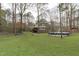 Large backyard featuring pool and wooded area surrounding the property at 900 Stoneybrook Dr, Sanford, NC 27330