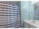 Clean bathroom featuring a shower with a striped curtain, vanity with a mirror at 900 Stoneybrook Dr, Sanford, NC 27330