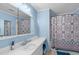 Classic bathroom with blue walls, vanity and shower with patterned curtain at 900 Stoneybrook Dr, Sanford, NC 27330