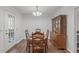 Dining room with wood table and chairs set, hardwood floors and china cabinet at 900 Stoneybrook Dr, Sanford, NC 27330