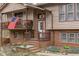 Close up of the exterior of the house, featuring wood and brick and a second story balcony at 900 Stoneybrook Dr, Sanford, NC 27330