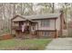 Exterior elevation of house, showing brick and wood construction and a second story balcony at 900 Stoneybrook Dr, Sanford, NC 27330