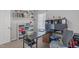 Organized office with a large desk, shelving, and comfortable chair at 900 Stoneybrook Dr, Sanford, NC 27330