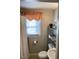 Functional bathroom featuring a shower curtain and shelving for storage at 907 St Marys St, Raleigh, NC 27605