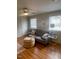 Cozy living room with bright windows and hardwood floors at 907 St Marys St, Raleigh, NC 27605