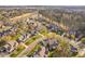An inviting golf community features well-maintained homes, lush landscaping, and access to a golf course and other amenities at 9320 Teton Pines Way, Raleigh, NC 27617