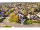 A beautiful neighborhood with mature trees, manicured lawns, and a lake create a serene and inviting environment at 9320 Teton Pines Way, Raleigh, NC 27617