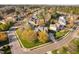 Expansive aerial view of a neighborhood showcasing a house with mature trees, landscaping, and inviting curb appeal at 9320 Teton Pines Way, Raleigh, NC 27617