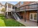 Multi-level backyard deck leading to a well-maintained yard, creating an ideal outdoor living space at 9320 Teton Pines Way, Raleigh, NC 27617