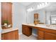 Bathroom vanity with double sinks, storage, and large mirror at 9320 Teton Pines Way, Raleigh, NC 27617