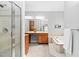 Bright bathroom featuring double sinks, soaking tub, and glass enclosed shower at 9320 Teton Pines Way, Raleigh, NC 27617