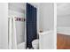 Bright bathroom featuring shower with a patterned curtain and neutral finishes at 9320 Teton Pines Way, Raleigh, NC 27617