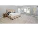Spacious primary bedroom with carpeted floors, natural light, and ensuite bath at 9320 Teton Pines Way, Raleigh, NC 27617