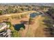 Golf course with lush greenery and scenic water hazards provide a challenging yet rewarding golfing experience at 9320 Teton Pines Way, Raleigh, NC 27617