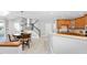 Open kitchen and dining area with stainless steel appliances and granite countertops at 9320 Teton Pines Way, Raleigh, NC 27617