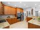 Gourmet kitchen features stainless steel appliances, granite countertops, and ample cabinet space at 9320 Teton Pines Way, Raleigh, NC 27617