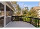 A screened porch offering views of the backyard and a well-maintained lawn at 9320 Teton Pines Way, Raleigh, NC 27617