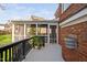 Screened-in porch on a brick house with plants and views of the backyard at 9320 Teton Pines Way, Raleigh, NC 27617