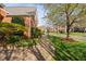 Well-manicured side yard with a brick walkway and lush landscaping at 9320 Teton Pines Way, Raleigh, NC 27617