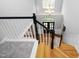 View from the top of the staircase, overlooking the foyer with hardwood floors at 9320 Teton Pines Way, Raleigh, NC 27617