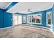 Bright sunroom with tile floors, large windows, and a sliding door leading to the backyard at 9320 Teton Pines Way, Raleigh, NC 27617