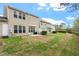 Spacious backyard featuring lush green grass and an open area, ideal for outdoor activities at 1008 Garden Square Ln, Morrisville, NC 27560