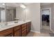 Bathroom boasts dual sinks, ample counter space, and a view into the walk-in closet at 1008 Garden Square Ln, Morrisville, NC 27560