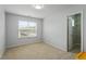 Spacious bedroom with a window providing abundant natural light and a glimpse of the neighborhood at 1008 Garden Square Ln, Morrisville, NC 27560