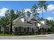 Beautiful clubhouse with architectural details, including a tower and multiple dormer windows at 1008 Garden Square Ln, Morrisville, NC 27560