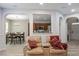 Cozy living room showcases archway to kitchen and dining, modern flooring, and neutral paint at 1008 Garden Square Ln, Morrisville, NC 27560