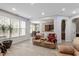 Living room filled with light and featuring views into kitchen and dining areas, with modern flooring at 1008 Garden Square Ln, Morrisville, NC 27560