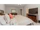 Bright main bedroom with bedside table and access to main bathroom at 1008 Garden Square Ln, Morrisville, NC 27560