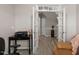 Office room with a desk, printer, and chair, with glass doors to the entry way at 1008 Garden Square Ln, Morrisville, NC 27560
