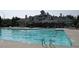 Community pool with ample seating, umbrellas and a large swimming area at 1008 Garden Square Ln, Morrisville, NC 27560