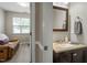 Cozy half-bathroom, featuring a single vanity with a decorative mirror and wall-mounted towel rack at 1008 Garden Square Ln, Morrisville, NC 27560