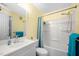 Bright bathroom featuring a vanity with a sink, a toilet, and a shower/tub combination with a shower curtain at 101 Hunting Chase # 2B, Cary, NC 27513