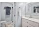 Neutral bathroom featuring a sink and vanity, toilet, and a glass enclosed shower with a towel rack at 101 Hunting Chase # 2B, Cary, NC 27513