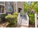 Condo exterior showing white stairway and greenery at 101 Hunting Chase # 2B, Cary, NC 27513
