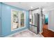 Bright kitchen nook with stainless refrigerator and view of the outdoors through large window at 101 Hunting Chase # 2B, Cary, NC 27513