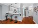 Bright, airy kitchen features a breakfast bar, modern lighting, and seamless flow to the dining area at 101 Hunting Chase # 2B, Cary, NC 27513