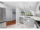 Open kitchen showcasing stainless steel appliances and a seamless flow to the adjacent living area at 101 Hunting Chase # 2B, Cary, NC 27513