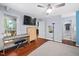Relaxing main bedroom with hardwood floors, natural light, and a door leading to the back deck at 101 Hunting Chase # 2B, Cary, NC 27513