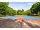 Tennis courts showcasing a well-maintained playing surface with lush tree surrounds at 101 Hunting Chase # 2B, Cary, NC 27513